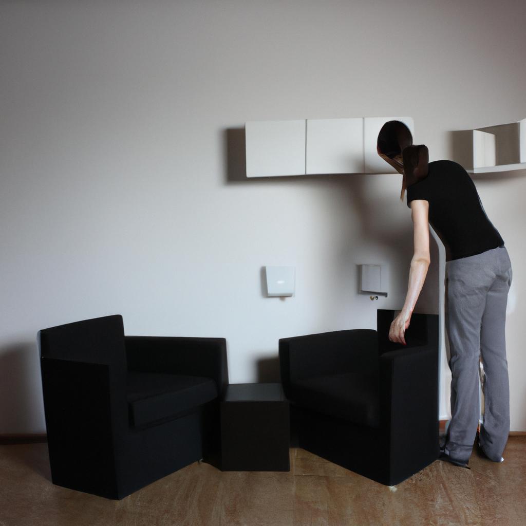 Person arranging furniture in room